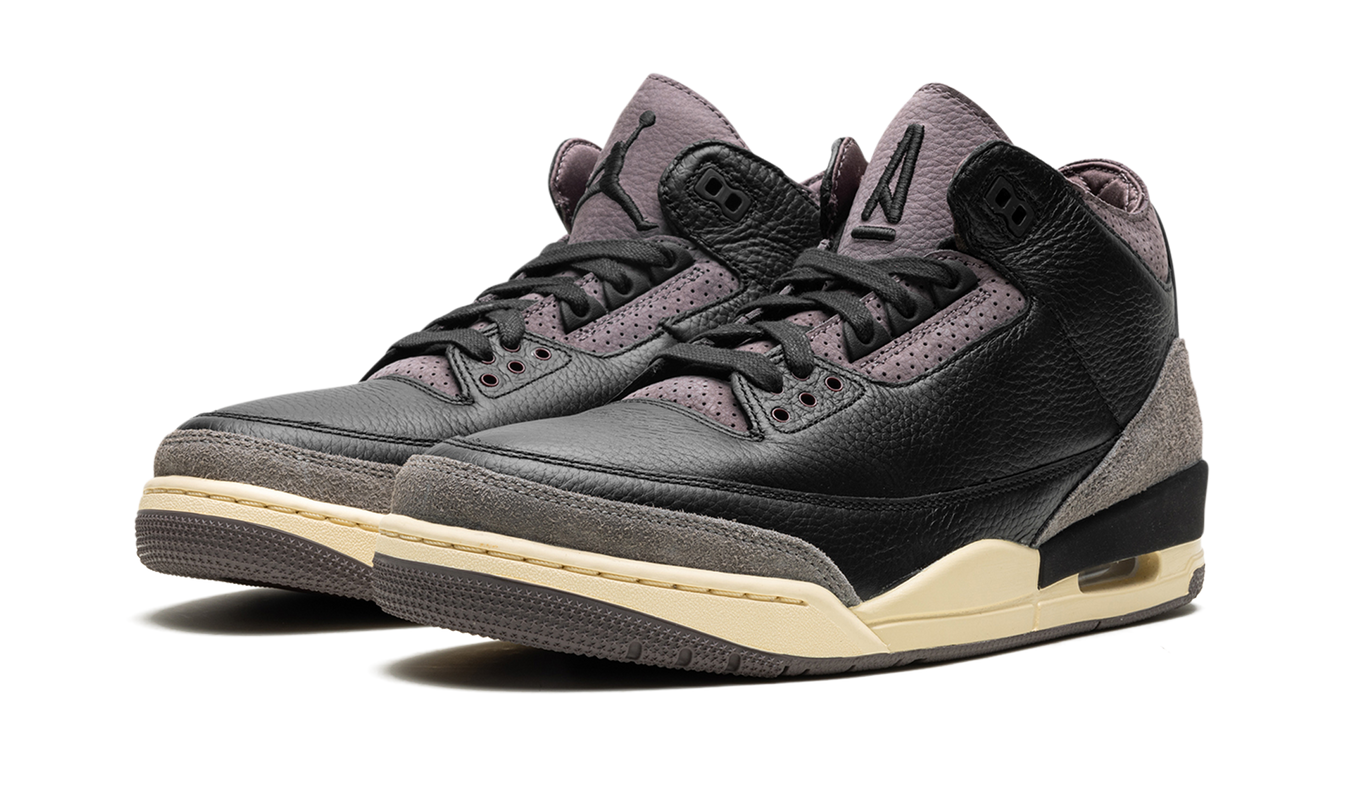 Zwarte Air Jordan 3 WMNS schoenen met A Ma Maniére branding en stijlvolle details, gedragen door een model.