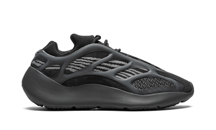 Zwarte Yeezy 700 V3 "Dark Glow" sneakers met opvallende glow-in-the-dark details, getoond op een witte achtergrond.