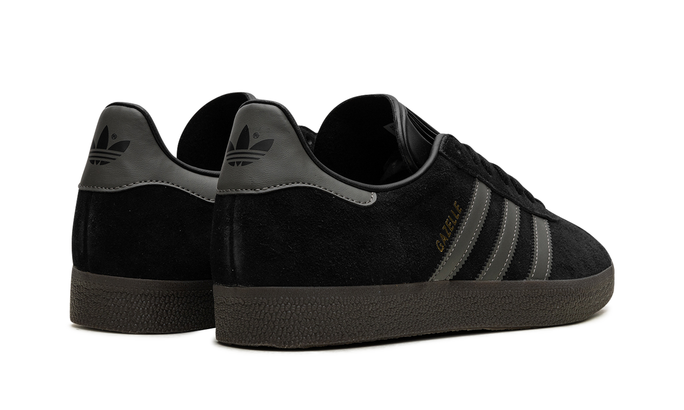 Zwarte Adidas Gazelle schoenen met goudkleurige details, comfortabele sneakers voor dames en heren