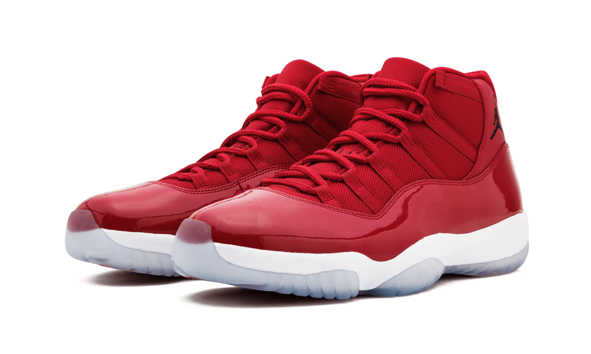Witte en zwarte Air Jordan 11 Retro sneakers "Win Like 96" met glanzende afwerking en iconisch ontwerp.