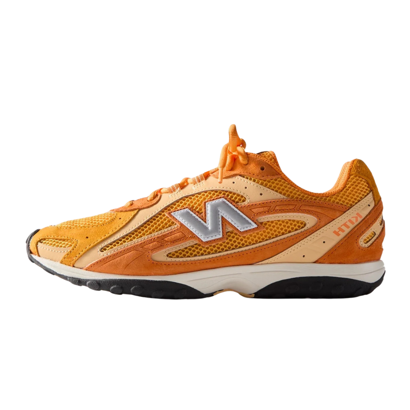 Oranje New Balance 204L Kith sneakers van CAPE EXCLUSIVES, close-up van de sportieve schoen met witte details.