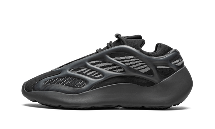 Zwarte Yeezy 700 V3 Dark Glow sneakers van Mijn winkel met glow-in-the-dark details en sportieve uitstraling.
