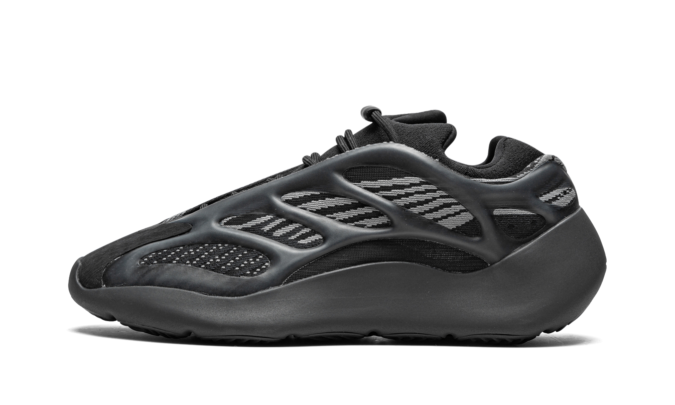 Zwarte Yeezy 700 V3 Dark Glow sneakers van Mijn winkel met glow-in-the-dark details en sportieve uitstraling.