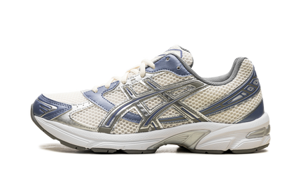 Asics Gel 1130 schoenen in crème en blauwe kleur, sportieve sneakers voor heren, zichtbaar op de afbeelding