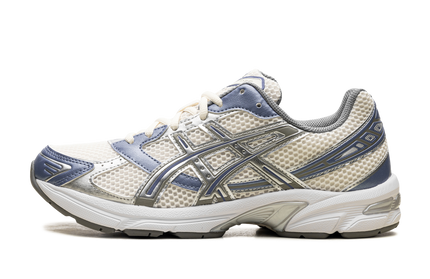 Asics Gel 1130 schoenen in crème en blauwe kleur, sportieve sneakers voor heren, zichtbaar op de afbeelding