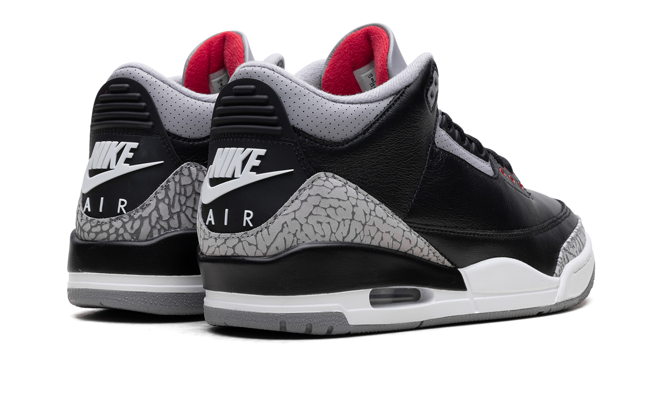 Zwarte Air Jordan 3 sneakers met cementprint en leren details, sportief en iconisch design, passend bij casual outfits.