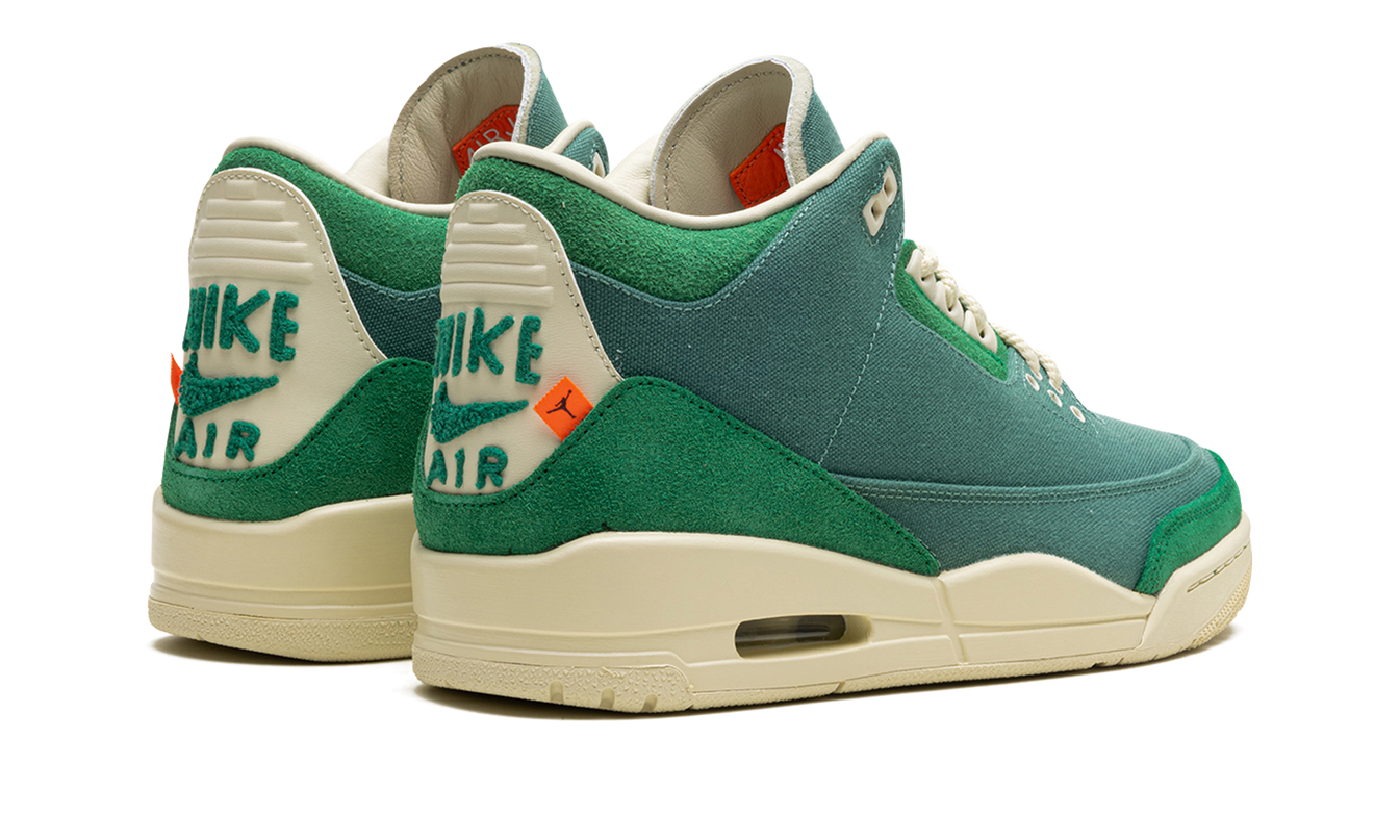 Witte Air Jordan 3 WMNS schoenen met kleurrijke opvallende details en logo, ontworpen door Nina Chanel Abney.